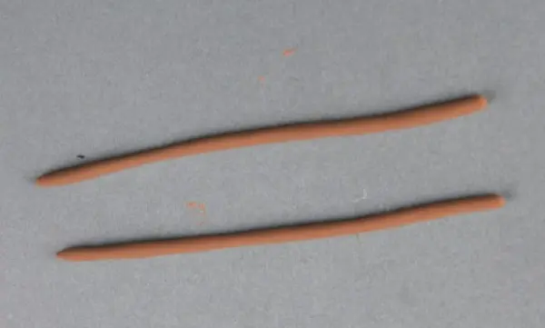 Two finished slim strips of clay