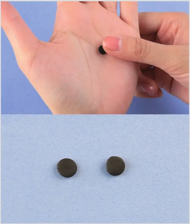 Flatten two pieces of black clay
