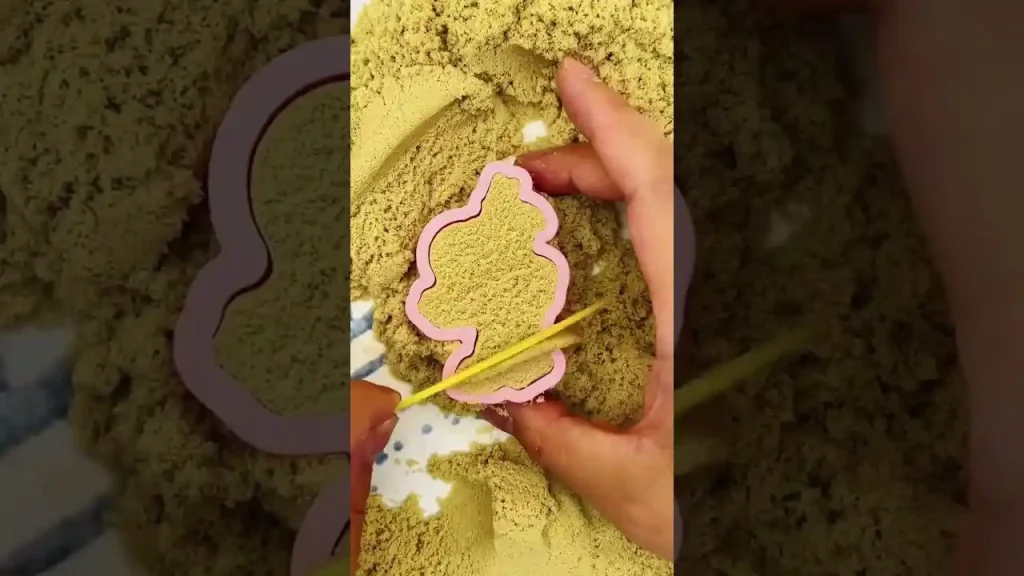 Use the magical kinetic sand to make an astronaut stamp
